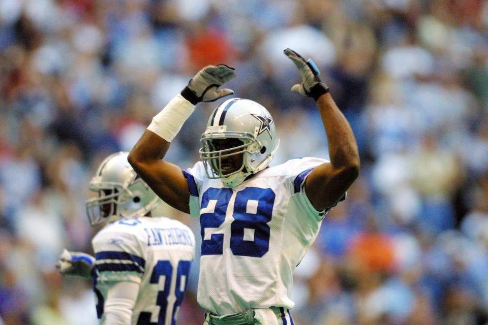 Darren Woodson of the Dallas Cowboys celebrates during a game against the Arizona Cardinals at Texas Stadium, Oct. 28, 2001.