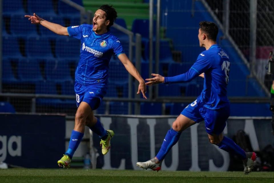 Enes Unal (left) celebrates after scoring the only goal in Getafe&#x002019;s win over Real Madrid (Bernat Armangue/AP). (AP)