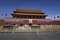 Chinese paramilitary policemen wearing face masks to help curb the spread of the coronavirus stand guard at the quiet Tiananmen Gate in Beijing, Sunday, Jan. 10, 2021. More than 360 people have tested positive in a growing COVID-19 outbreak south of Beijing in neighboring Hebei province. (AP Photo/Andy Wong)