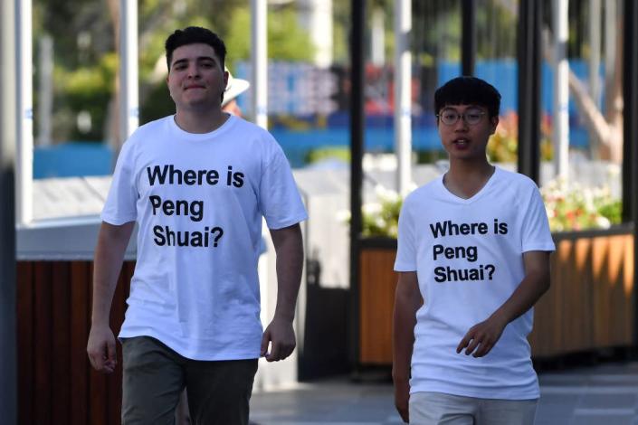 Australian human rights campaigner Drew Pavlou (left) is pictured wearing a "Where is Peng Shuai?" T-shirt, referring to the former doubles world number one from China, on the grounds outside the Australian Open tennis tournament in Melbourne on January 25, 2022.<span class="copyright">Paul Crock—AFP/Getty Images</span>