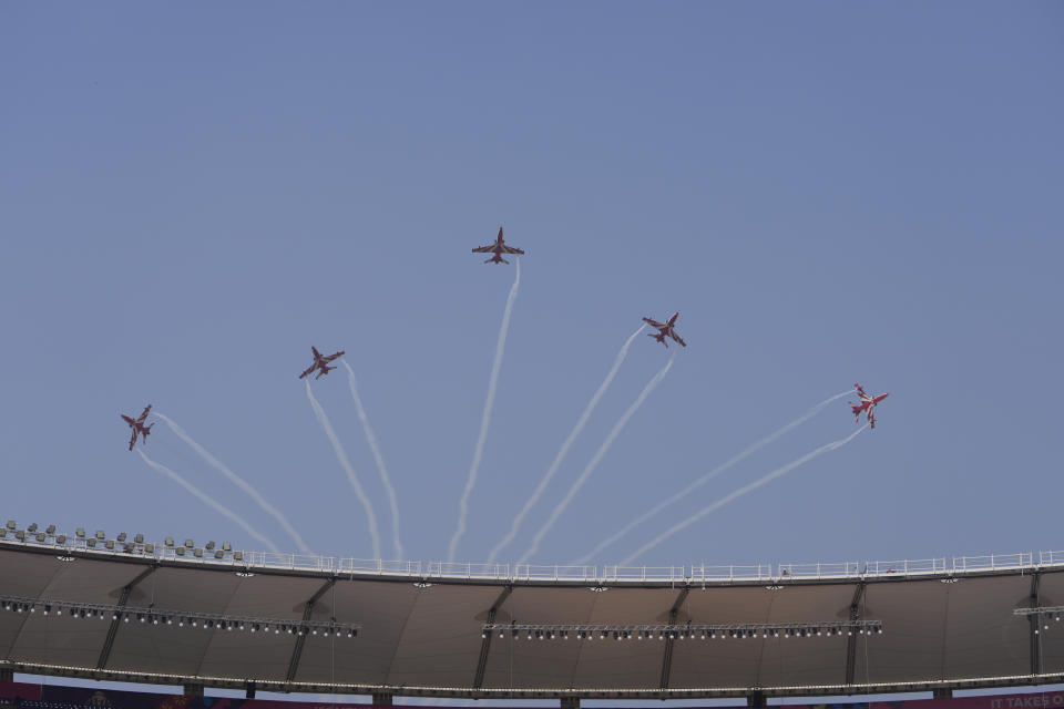 The Surya Kiran team of Indian Air Force performs aerobatic display over Narendra Modi stadium ahead of the ICC Men's Cricket World Cup final match between India and Australia in Ahmedabad, India, Friday, Nov. 17, 2023. (AP Photo/Ajit Solanki)