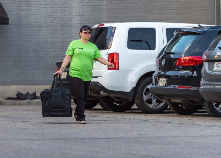 A Waitr delivery driver picks up an order at local restaurant in Lafayette  Wednesday, July 17, 2019.
