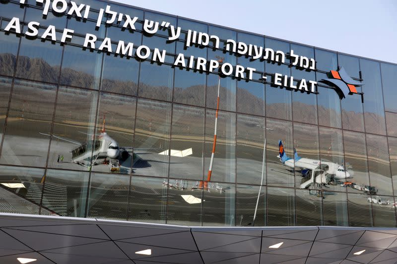 FILE PHOTO: Planes are reflected in the facade of the Ramon International Airport after an inauguration ceremony for the new airport, just outside the southern Red Sea resort city of Eilat, Israel