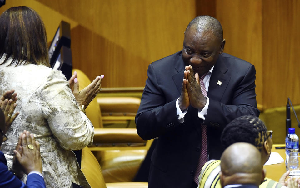 South Africa President Cyril Ramaphosa acknowledges members of parliament in Cape Town, South Africa, Wednesday, May 22, 2019. Ramaphosa has taken steps to crack down on corruption Wednesday as the country's new parliament voted him to lead the country for a five-year term. (AP Photo)