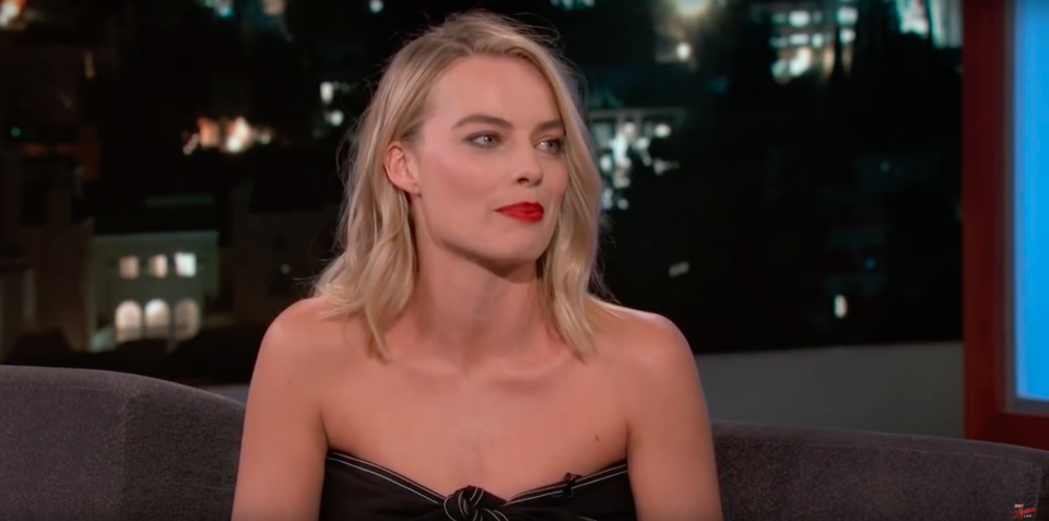 Margot Robbie looked stunning in a black strapless dress and red-lipstick. Source: Supplied