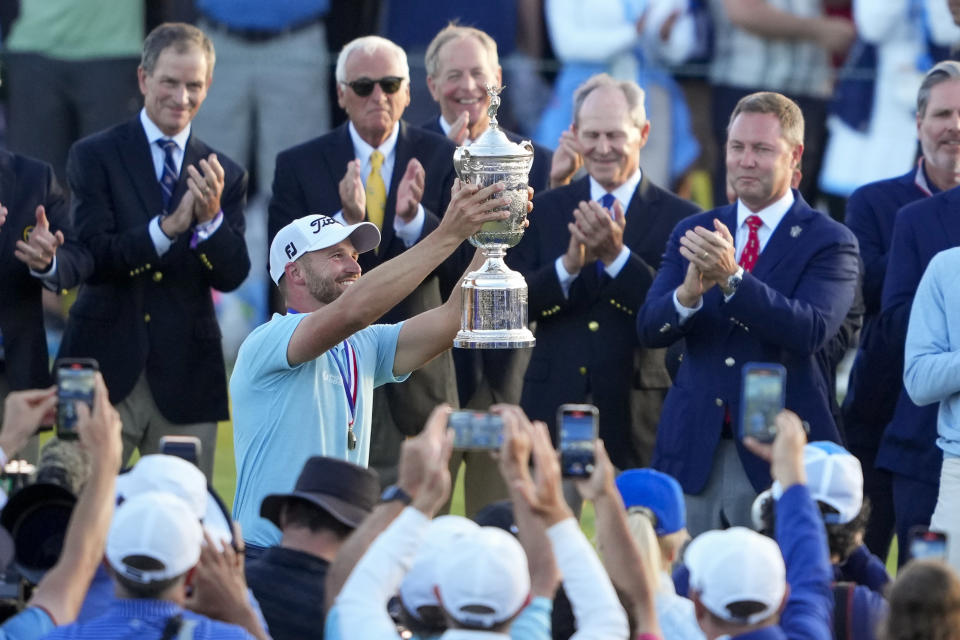 Wyndham Clark holds the trophy after winning the U.S. Open golf tournament at Los Angeles Country Club on Sunday, June 18, 2023, in Los Angeles. (AP Photo/Lindsey Wasson)