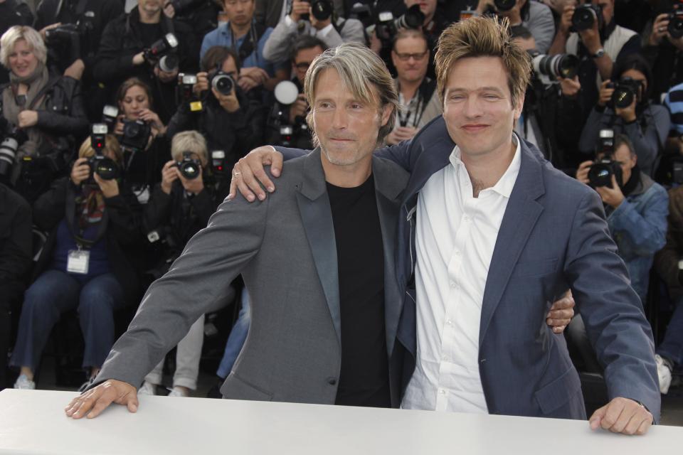 Actor Mads Mikkelsen, left and director Thomas Vinterberg pose during a photo call for The Hunt at the 65th international film festival, in Cannes, southern France, Sunday, May 20, 2012. (AP Photo/Joel Ryan)