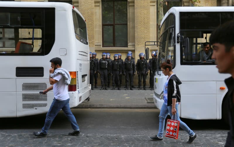 Azerbaijani law enforcement officers stand guard during an opposition rally in Baku