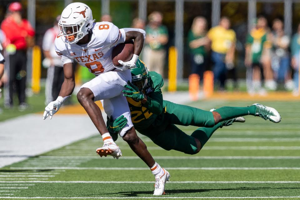 Oct 30, 2021; Waco, Texas, USA; Baylor Bears safety JT Woods (22) tackles Texas Longhorns wide receiver Xavier Worthy (8) in the second half of an NCAA football game at McLane Stadium. Mandatory Credit: Stephen Spillman-USA TODAY Sports ORG XMIT: IMAGN-452721 (Via OlyDrop)