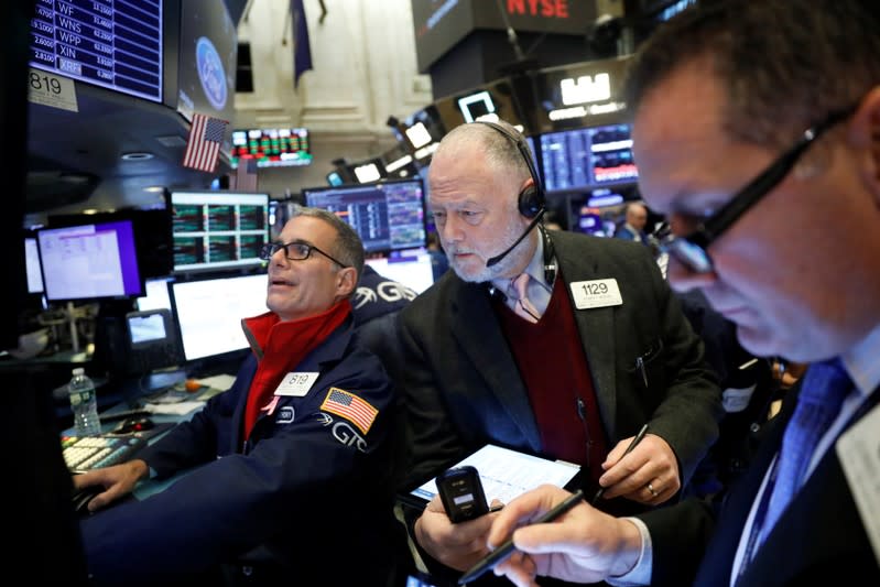 Traders work on the floor of the New York Stock Exchange shortly after the opening bell in New York City