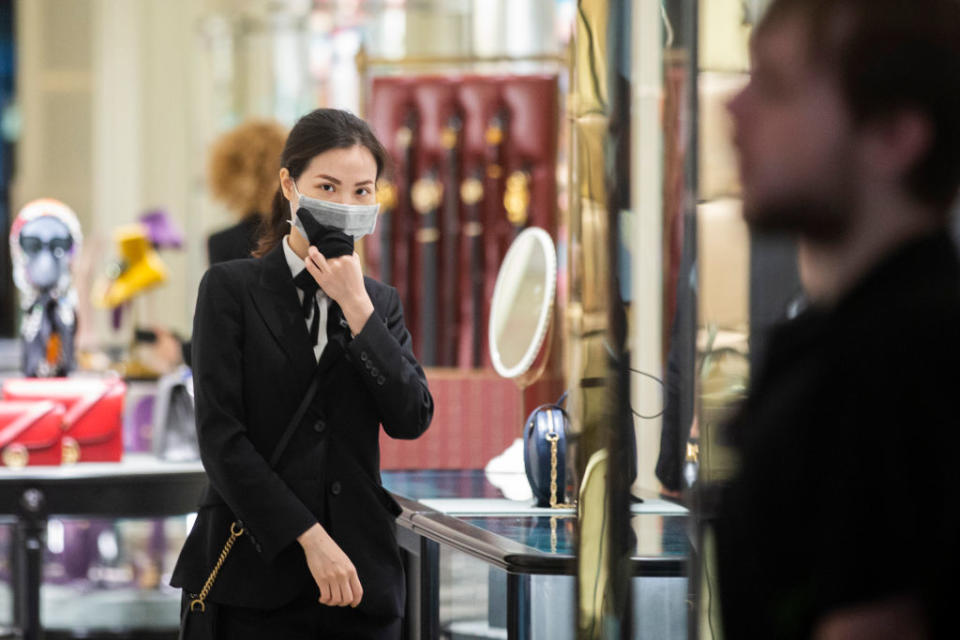 Shop assistants in luxury outlets in Sydney's CBD are seen wearing masks on January 31, 2020 in Sydney, Australia. (Photo by Jenny Evans/Getty Images)