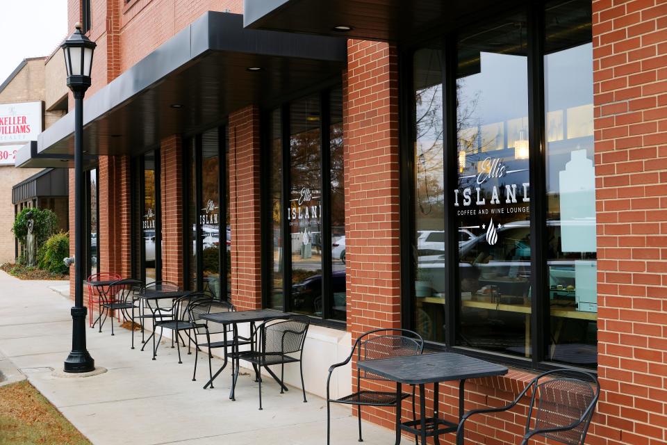 Tables and chairs provide outdoor seating at Ellis Island Coffee, 130 N Broadway, Suite 150, in downtown Edmond.