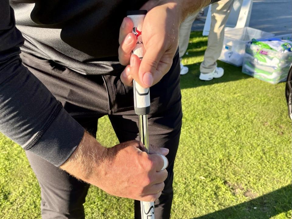 David Lingmerth demonstrates his two-handed putting grip, using a longer putting shaft with split grips, that has given him more confidence on the greens.