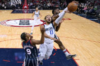 Houston Rockets forward David Nwaba, right, blocks the shot of Dallas Mavericks guard Jalen Brunson (13) during the second half of an NBA basketball game Friday, Jan. 7, 2022, in Houston. (AP Photo/Eric Christian Smith)