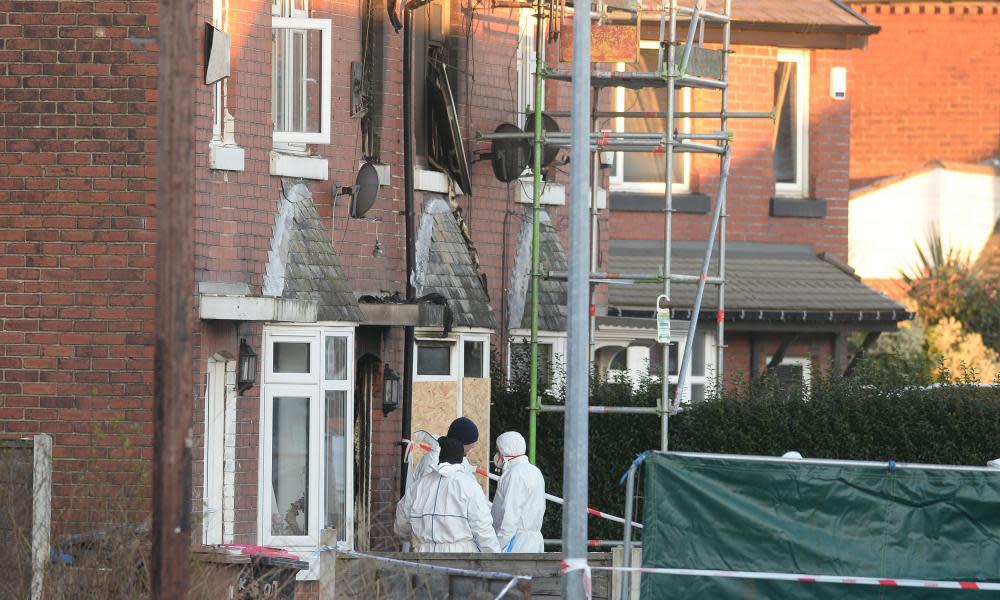 Forensics officers at the scene of the fire in Walkden, Greater Manchester