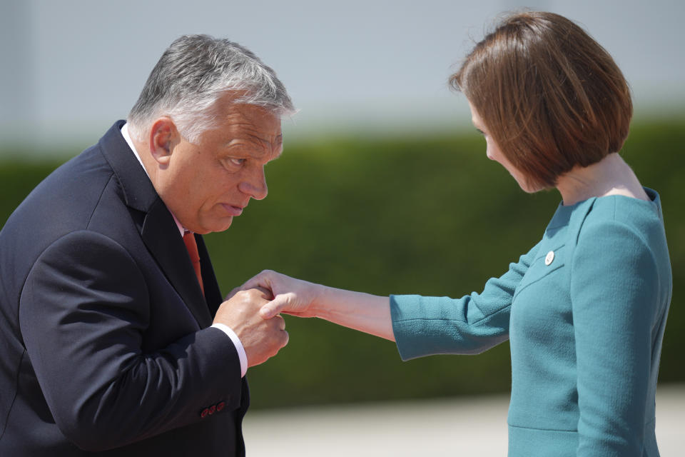 Hungary's Prime Minister Viktor Orban, left, greets Moldova's President Maia Sandu during arrivals for the European Political Community Summit at the Mimi Castle in Bulboaca, Moldova, Thursday, June 1, 2023. Leaders are meeting in Moldova Thursday for a summit aiming to show a united front in the face of Russia's war in Ukraine and underscore support for the Eastern European country's ambitions to draw closer to the West and keep Moscow at bay. (AP Photo/Vadim Ghirda)