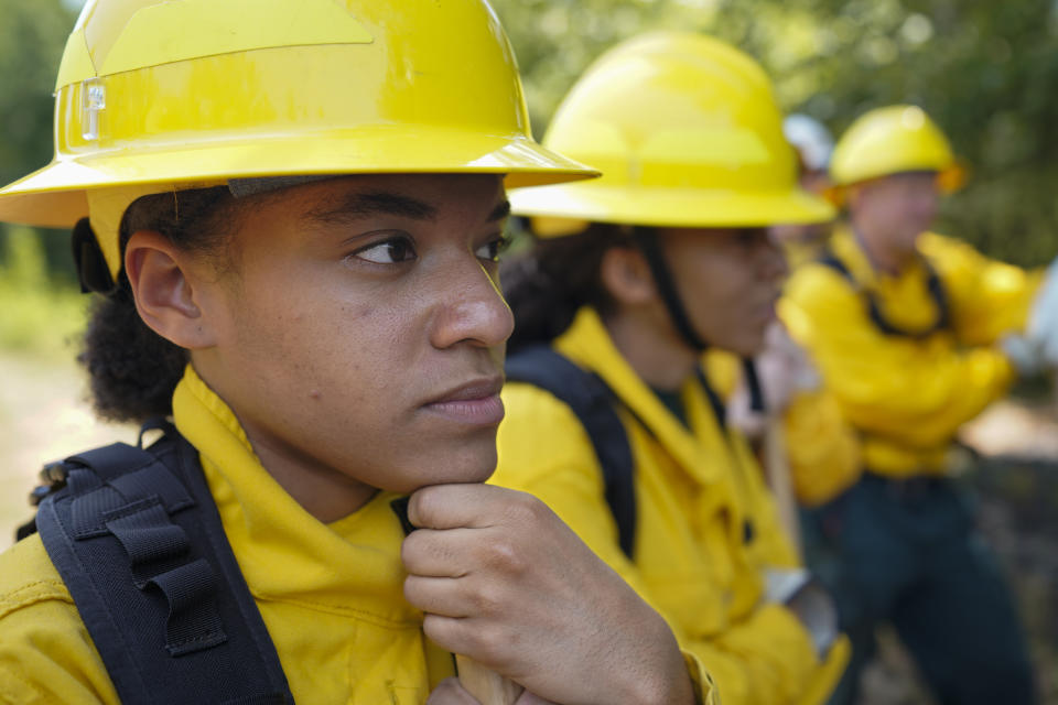 Taylor Mohead listens during a wildland firefighter training Friday, June 9, 2023, in Hazel Green, Ala. A partnership between the U.S. Forest Service and four historically Black colleges and universities is opening the eyes of students of color who had never pictured themselves as fighting forest fires. (AP Photo/George Walker IV)