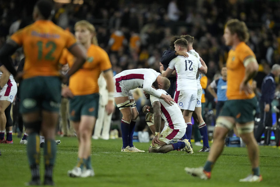 England's players celebrate their rugby union test match and series win over Australia in Sydney on Saturday, July 16, 2022. (AP Photo/Rick Rycroft)