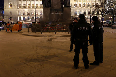 Police officers are seen at the scene where a man set himself on fire in downtown Prague, Czech Republic January 18, 2019. REUTERS/Milan Kamm