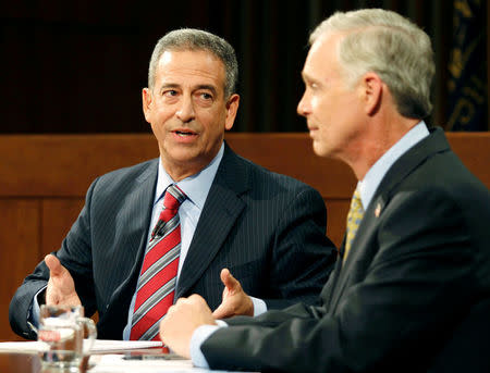 U.S. Senate candidates Democratic incumbent Senator Russ Feingold (L) and Republican challenger Ron Johnson debate at Marquette University in Milwaukee, Wisconsin, October 22, 2010. REUTERS/Allen Fredrickson/File Photo