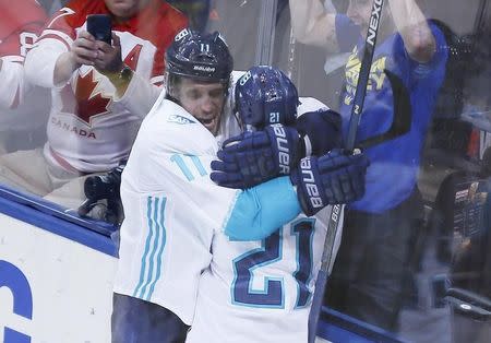 Sep 25, 2016; Toronto, Ontario, Canada; Team Europe forward Anze Kopitar (11) congratulates forward Tomas Tatar (21) after he scored the game winning goal against Team Sweden of a semifinal game in the 2016 World Cup of Hockey at Air Canada Centre. Team Europe defeated Team Sweden 3-2 in overtime. Mandatory Credit: John E. Sokolowski-USA TODAY Sports