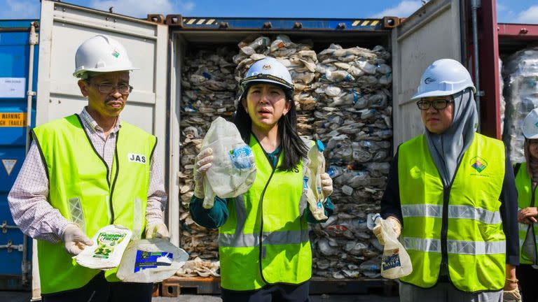 Yeo Bee Yin (middle) is seen holding up some plastic water bottles from Australia last year