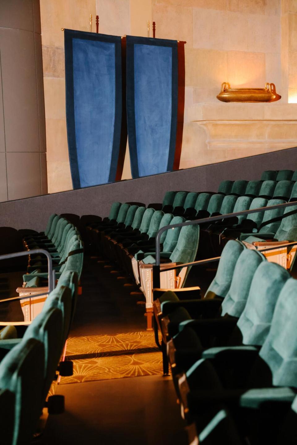 Green velvet seats in a movie palace.