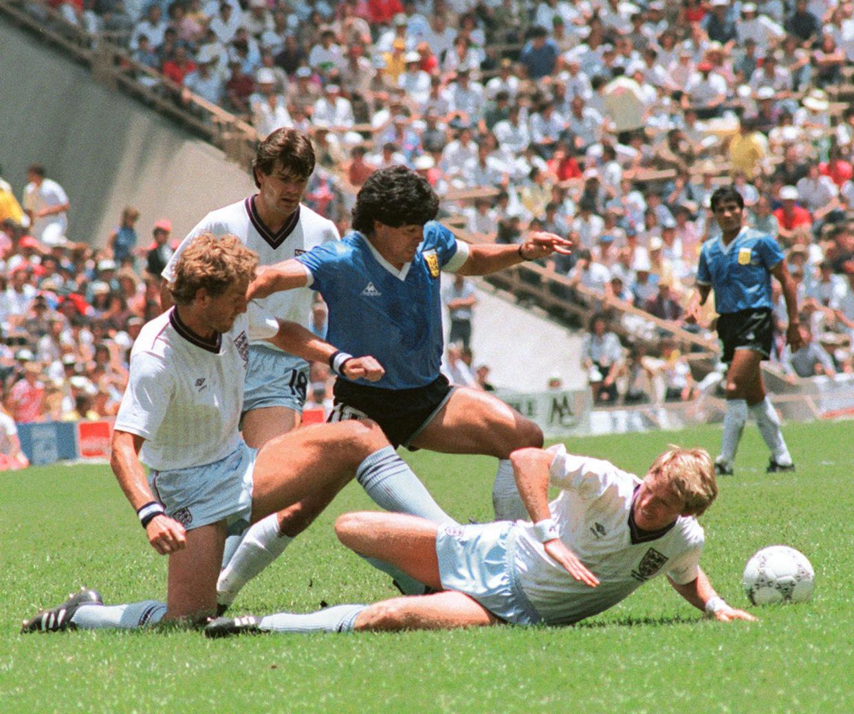 <p>Diego Maradona glides through England’s defence at the 1986 World Cup</p> (AFP via Getty Images)