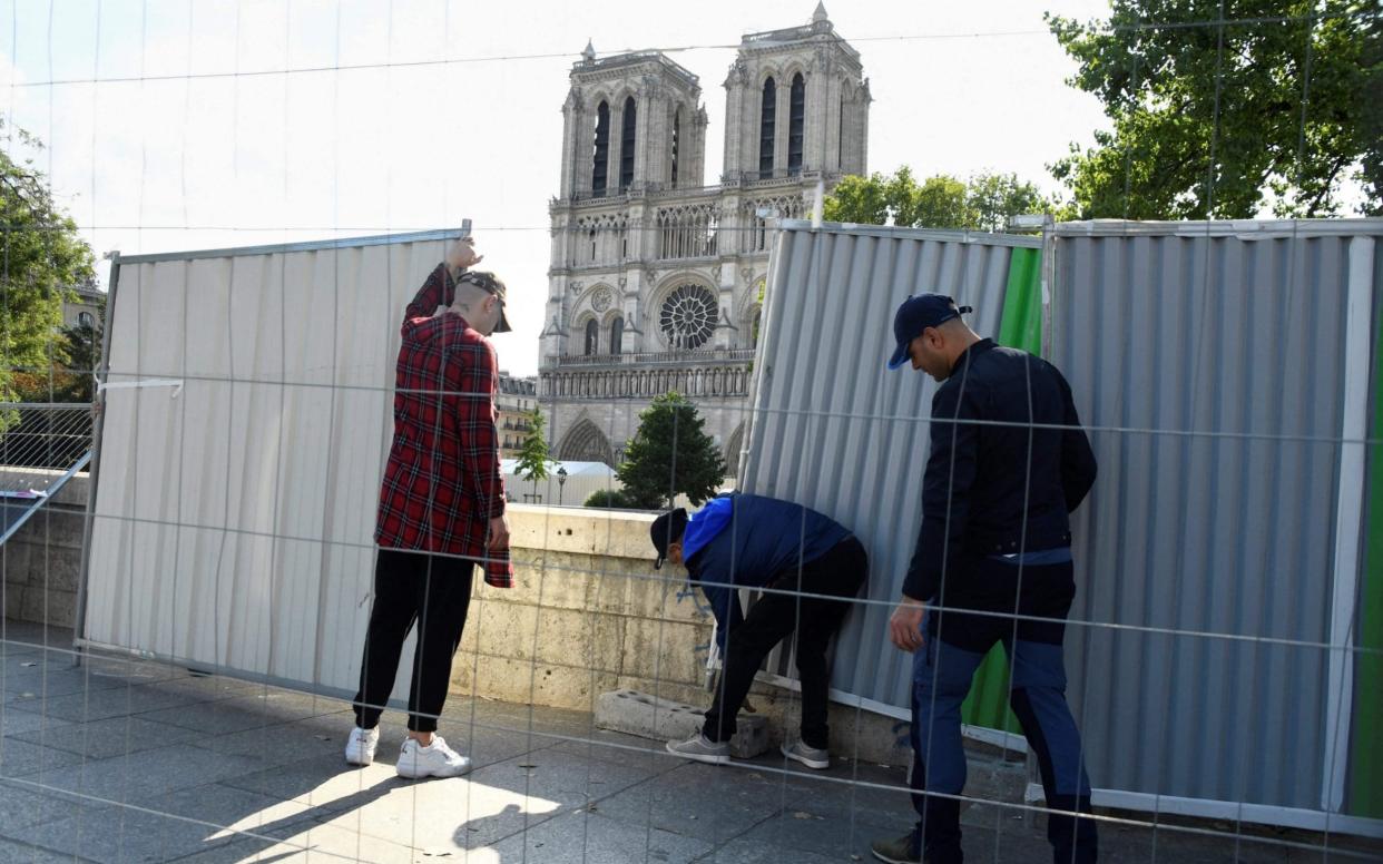 Fences in front of Notre-Dame cathedral in Paris before decontamination work. - BERTRAND GUAY/AFP