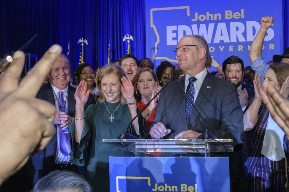 Louisiana Gov. John Bel Edwards arrives to address supporters at his election night watch party in Baton Rouge, La., Saturday, Nov. 16, 2019. On Saturday, voters reelected Edwards to a second term, as he defeated Republican businessman Eddie Rispone. (AP Photo/Matthew Hinton)