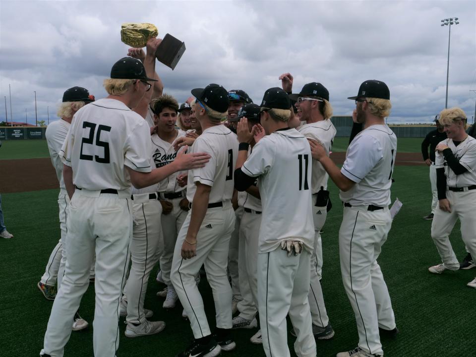 The Randall Raiders baseball team hoists the regional quarterfinal trophy after beating Hereford 13-3 on Friday, May 19, 2023 at West Texas A&M.