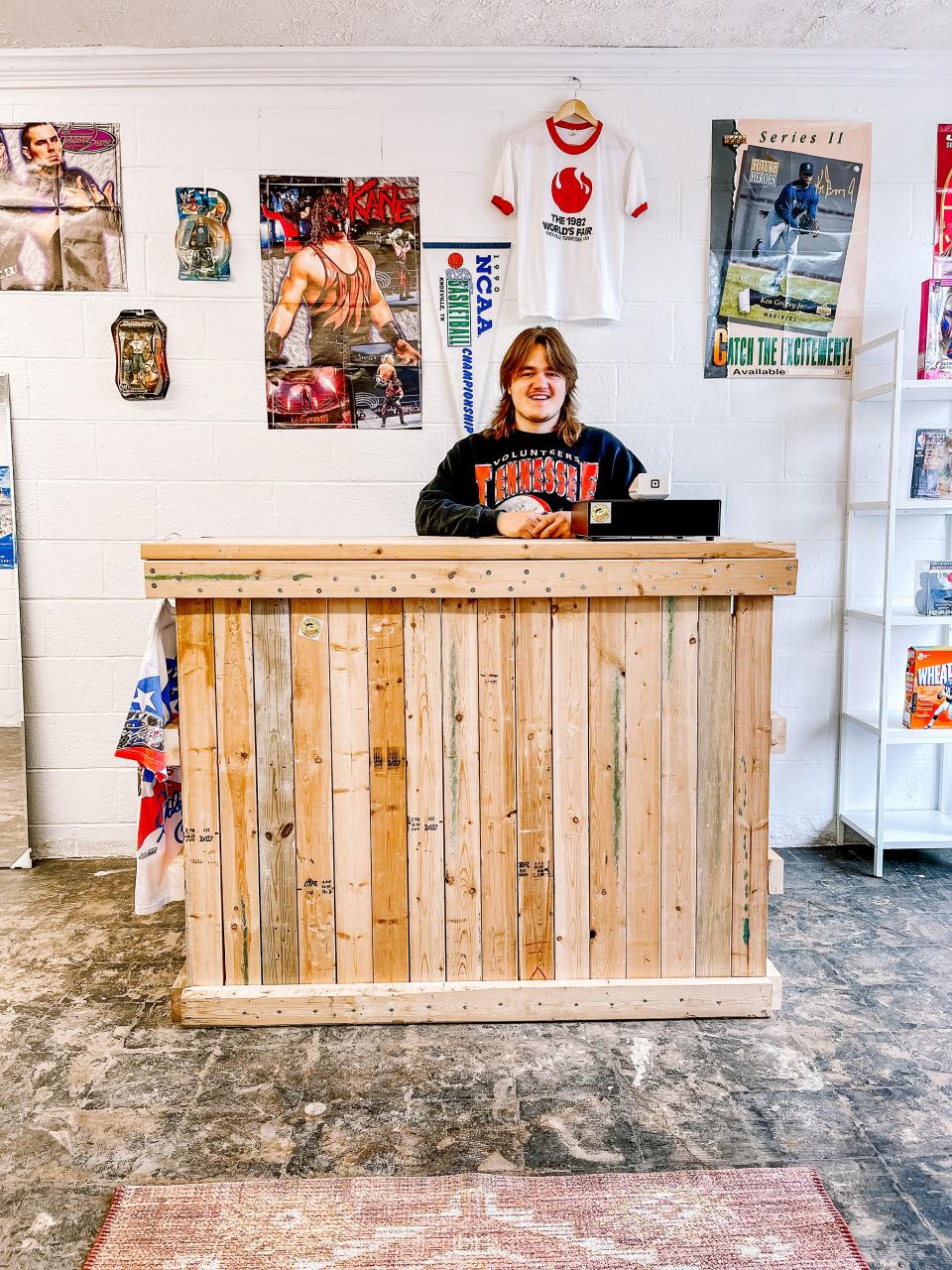 Bryson Richie had a contractor tear down the wall and repurpose the 2x4s into a shop counter.