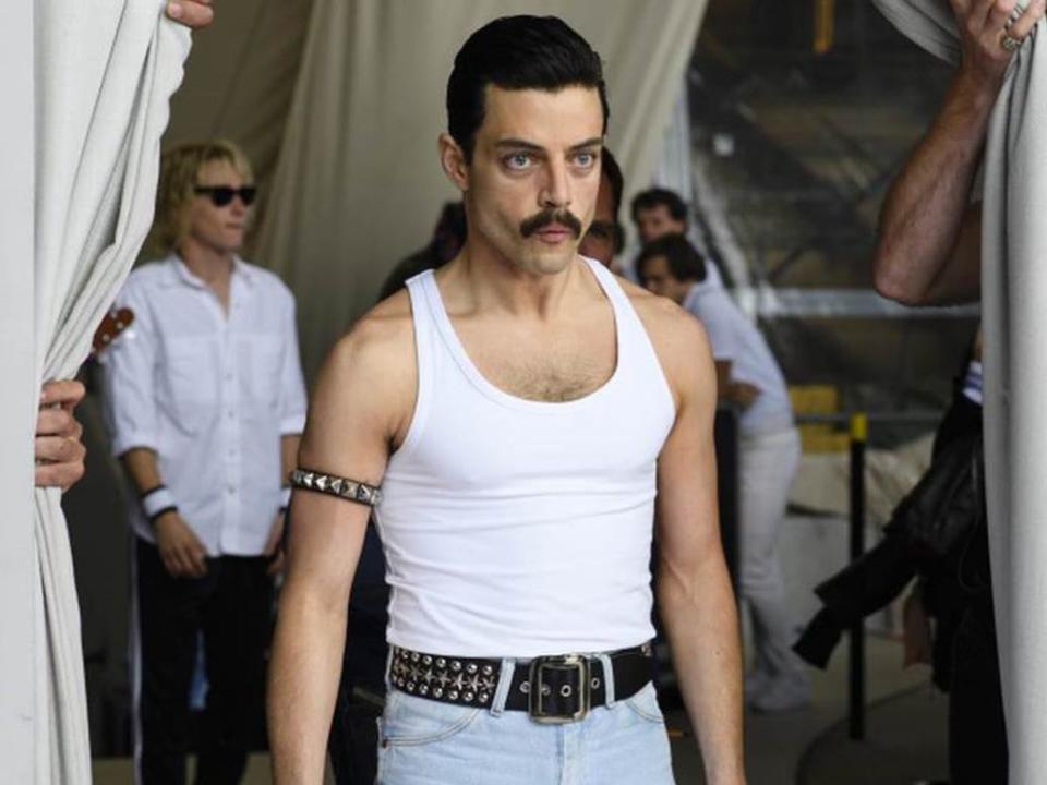 Rami Malek as Freddie Mercury wearing white tank top