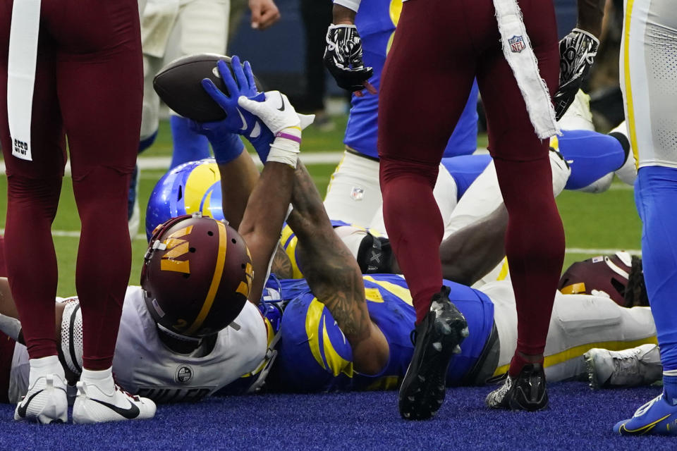 Los Angeles Rams running back Kyren Williams reacts after scoring a touchdown during the first half of an NFL football game against the Washington Commanders Sunday, Dec. 17, 2023, in Inglewood, Calif. (AP Photo/Marcio Jose Sanchez)