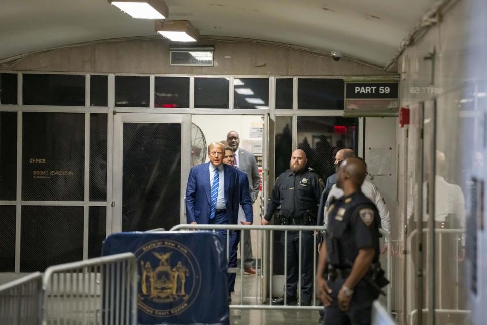 Donald Trump walks outside during a break in trial proceedings. <a href="https://newsroom.ap.org/detail/TrumpHushMoney/ad2d73cfb5a54d7eb6960763c738a8b6/photo" rel="nofollow noopener" target="_blank" data-ylk="slk:Mark Peterson/Pool Photo via AP;elm:context_link;itc:0;sec:content-canvas" class="link ">Mark Peterson/Pool Photo via AP</a>