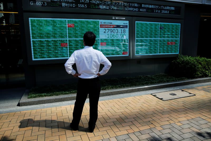 FILE PHOTO: Asian stocks drop as Fed shift reverberates