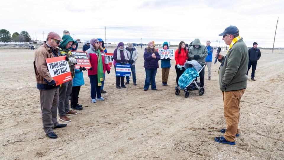 Rev. Mike Hollomon of Caldwell United Methodist and Emmett United Methodist prays with protesters against the death penalty outside of the Idaho Maximum Security Institution south of Boise Wednesday during prisoner Thomas Creech’s attempted execution.