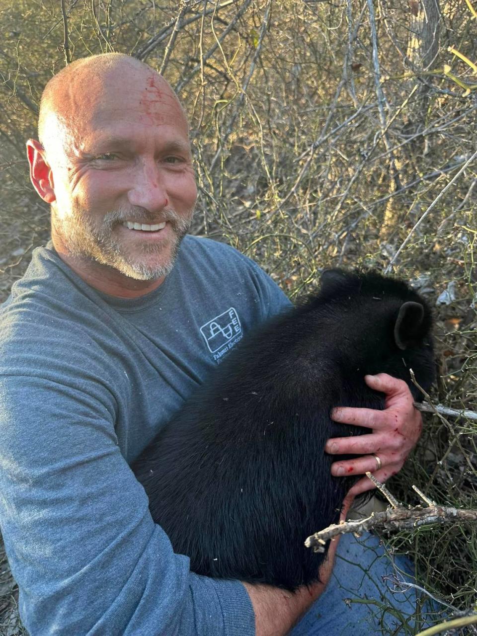 Steve Mock, a hog hunter, helped rescue Pojo the pig from a thorny patch on the edge of Springtown.