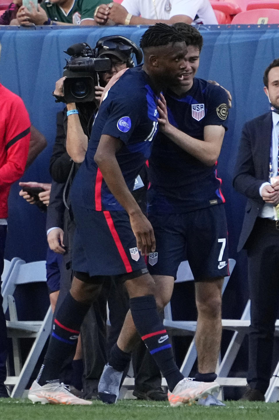 United States' Jordan Siebatcheu, left, celebrates his goal with Gio Reyna (7) against Honduras during the second half of a CONCACAF Nations League soccer semifinal Thursday, June 3, 2021, in Denver. (AP Photo/Jack Dempsey)