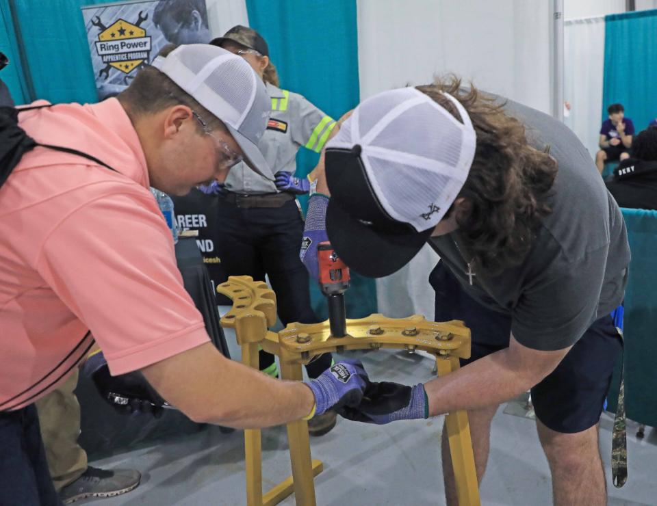 High school students work hands-on with recruiters from construction, engineering and transportation industry agencies during the two-day career day fair at the Volusia County Fairgrounds in DeLand, Thursday, Jan. 25, 2024.