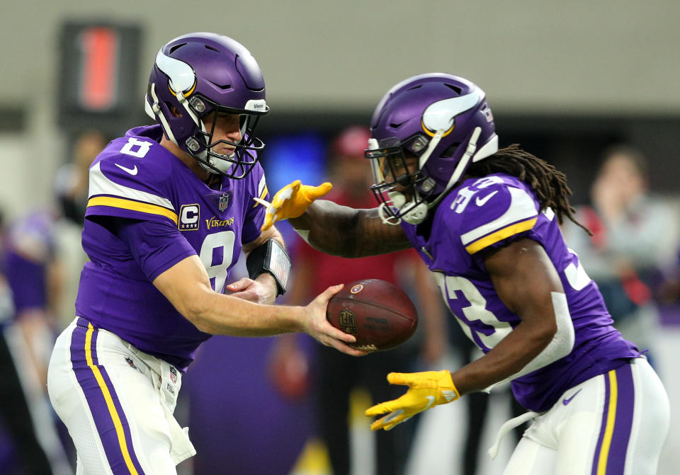 MINNEAPOLIS, MN - DECEMBER 30: Kirk Cousins #8 of the Minnesota Vikings hands the ball off to Dalvin Cook #33 in the first quarter of the game against the Chicago Bears at U.S. Bank Stadium on December 30, 2018 in Minneapolis, Minnesota. (Photo by Adam Bettcher/Getty Images)