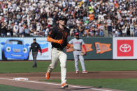 San Francisco Giants' Matt Chapman runs the bases on a grand slam against the Cincinnati Reds during the first inning of a baseball game Saturday, May 11, 2024, in San Francisco. (AP Photo/Godofredo A. Vásquez)
