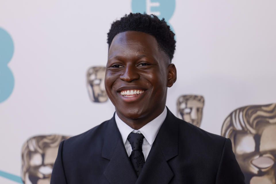 Toheeb Jimoh poses for photographers upon arrival at the 76th British Academy Film Awards, BAFTA's, in London, Sunday, Feb. 19, 2023. (Photo by Vianney Le Caer/Invision/AP)