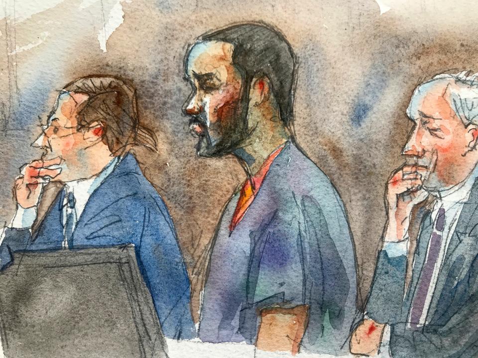 In courtroom sketch, R. Kelly, center, listens in federal court with his attorneys Doug Anton, left, and Steve Greenberg during his arraignment on sex-crime charges, Aug. 2, 2019 in New York.
