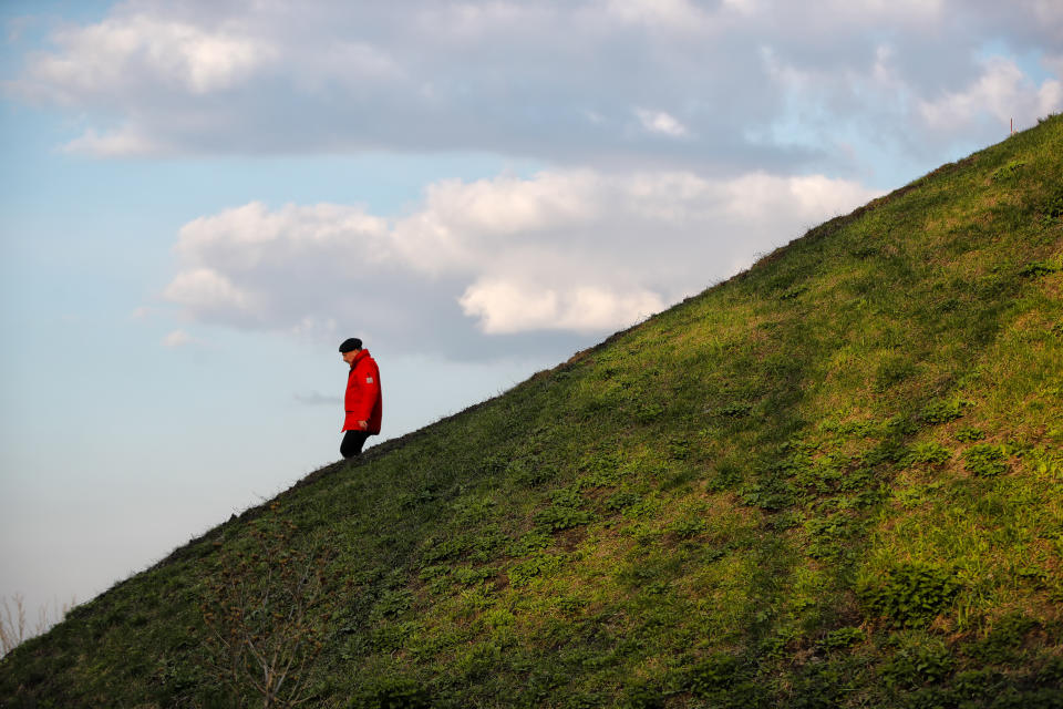 A man walks down a slope in a park in Kiev, Ukraine, Wednesday, April 17, 2019. The second round of presidential vote in Ukraine will take place on April 21. (AP Photo/Vadim Ghirda)