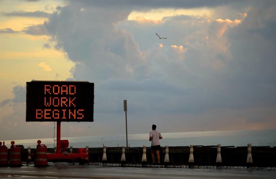 A jogger ran north along A1A in Fort Lauderdale in this file photo from July 24, 2014. This section of the seafront boulevard was damaged by Hurricane Sandy and reconstruction began days after this image.