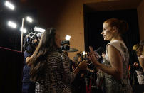 Jessica Chastain, star of "The Eyes of Tammy Faye," works the press line at the premiere of the film at the 2021 Toronto International Film Festival, Sunday, Sept. 12, 2021, in Toronto. (AP Photo/Chris Pizzello)