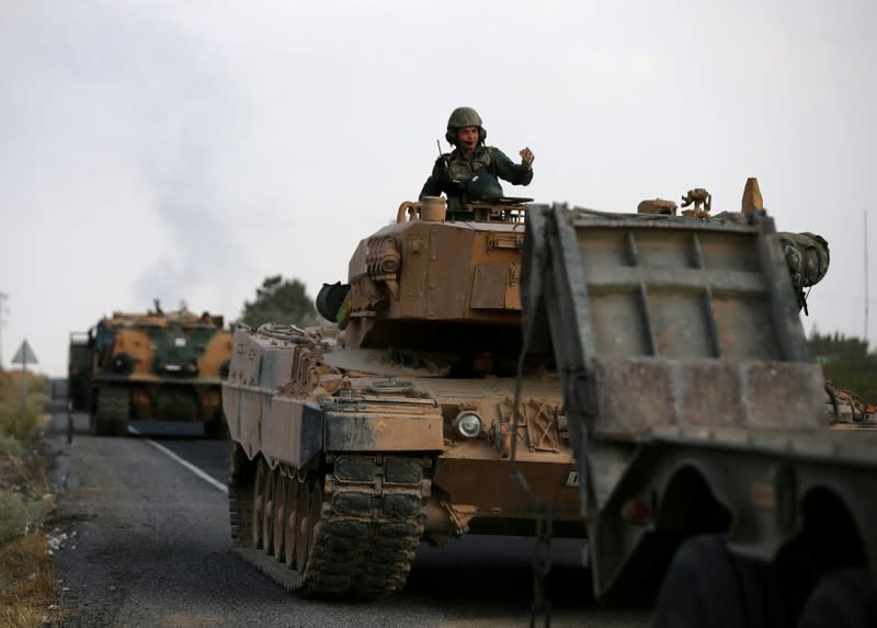 FILE PHOTO: Turkish army vehicles are moving on a road near the Turkish border town of Ceylanpinar