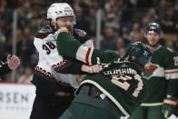 Arizona Coyotes center Liam O'Brien (38) and Minnesota Wild right wing Brandon Duhaime (21) fight during the second period of an NHL hockey game Tuesday, Nov. 30, 2021, in St. Paul, Minn. (AP Photo/Stacy Bengs)