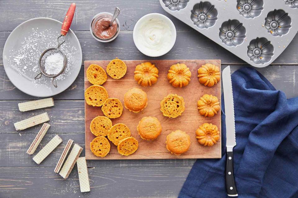 mini pumpkin bundt cakes sliced on wooded board